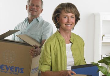 two people moving boxes