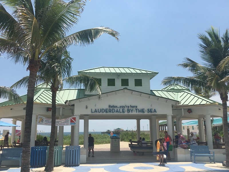 Lauderdale by the sea Relax sign Archway sign flanked by palm trees reads,