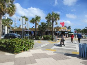 lauderdale by the sea downtown People crossing a small downtown street with a crosswalk