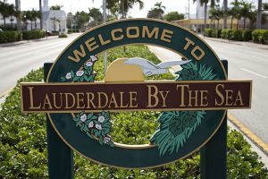 welcome to lauderdale by the sea Sign says,