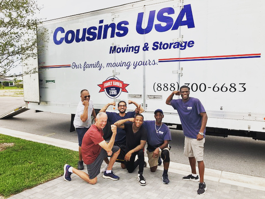Cousins USA Moving Crew in front of Moving Truck